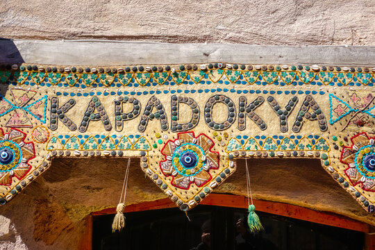 Handmade ornamental sign with Kapadokya text at shop entrance
