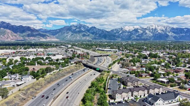 Aerial hyperlapse of Salt Lake City highway interchange and mountains