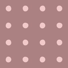 Soft pink polka dots on a muted mauve background pattern © Syaima Levantine