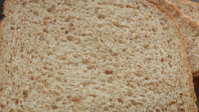 Wholemeal bread macro close up presentation slowly rotating stock footage