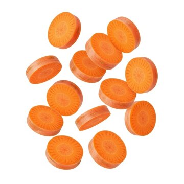 Freshly sliced carrot pieces on white background.