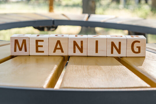 motivational word Meaning is laid out from letters on wooden cubes