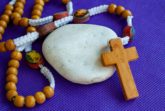 Holy Rosary on white stone with customizable space for text.