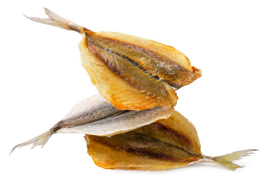 Dried salted fish falls on a white background. Isolated