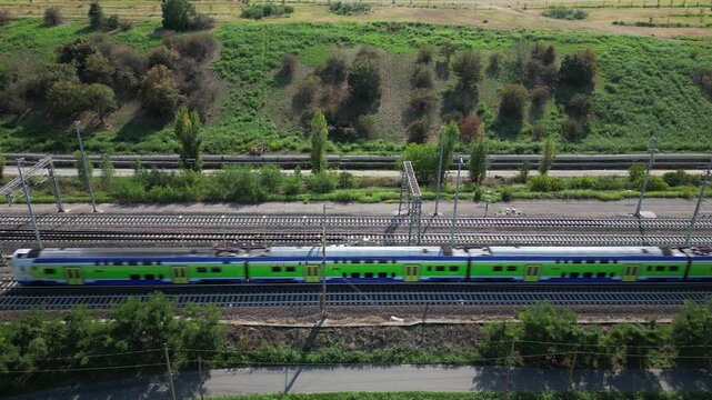 Europe, Italy , Milan - Frecciarossa Hight speed 300km h train railway from Milan  to Rome view from the drone - the faster way to travel in Italy for tourist and passengers - tourist destination 