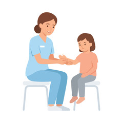 Fototapeta premium A gentle female nurse in blue scrubs examines the injured arm of a sad little girl sitting on a stool.