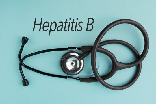 Stethoscope and a paper with the word Hepatitis B. Contact with blood, semen or other body fluids from an infected person. Medical concept. Immunization protocol and prevention.