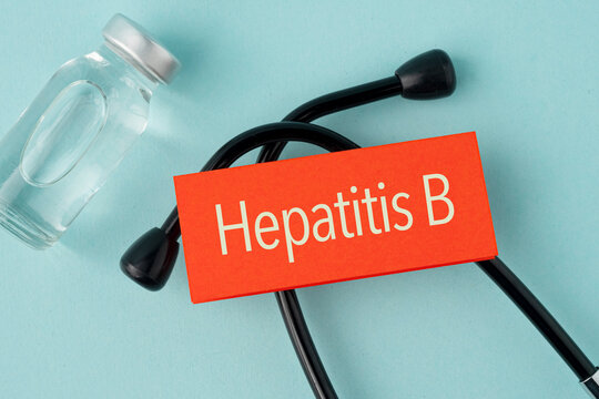 Stethoscope and a paper with the word Hepatitis B. Contact with blood, semen or other body fluids from an infected person. Medical concept. Immunization protocol and prevention.