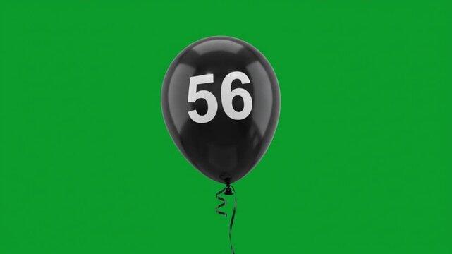 Black balloon with number 56 floating on green screen