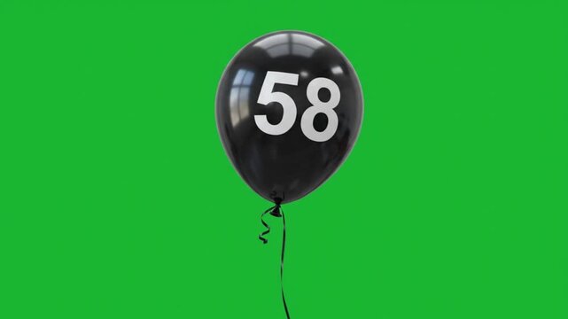 Black balloon with number 58 floating on green screen