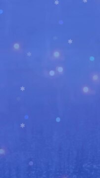 Animation of multiple glowing snowflakes particles falling against black background
