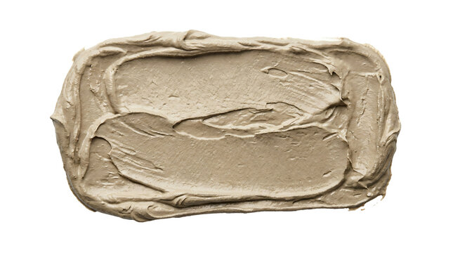 Thick textured beige clay mud smear with rough artistic edges displaying organic skincare mask material spread on transparent background