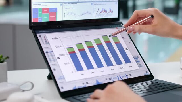 Data Analyst Carefully Studies Financial Dashboard