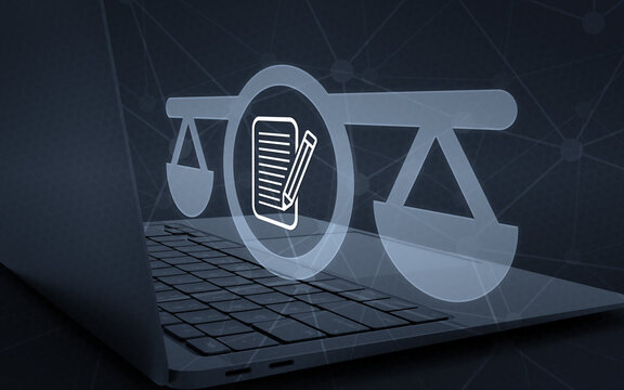 Specialized law and expert attorney concept featuring a digital scale of justice and document symbol hovering above a laptop keyboard for legal services.