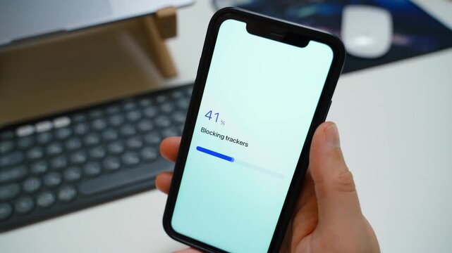Blocking trackers progress on smartphone screen completes with trackers blocked