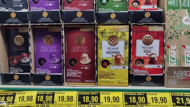 ITABIRA, MINAS GERAIS, BRAZIL - SEPTEMBER 04, 2026: Tres Coracoes coffee capsules packages displayed on supermarket shelf for sale with price tags.