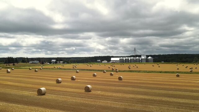 Farmland and grain silos pan right in Prince Edward Island, Canada