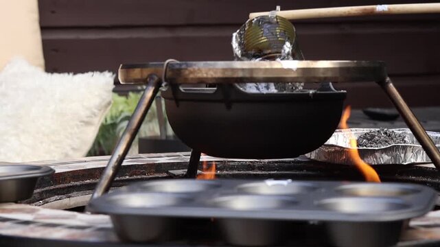 Pouring a perfect stream of glowing liquid metal into gray molds