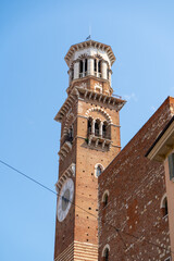 Obraz premium Torre dei Lamberti Medieval Clock Tower View against Blue Sky in Verona Old Town Center Veneto Italy.