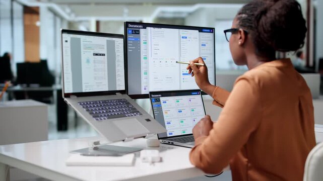 Woman Office Manager Efficiently Organizing Digital Documents