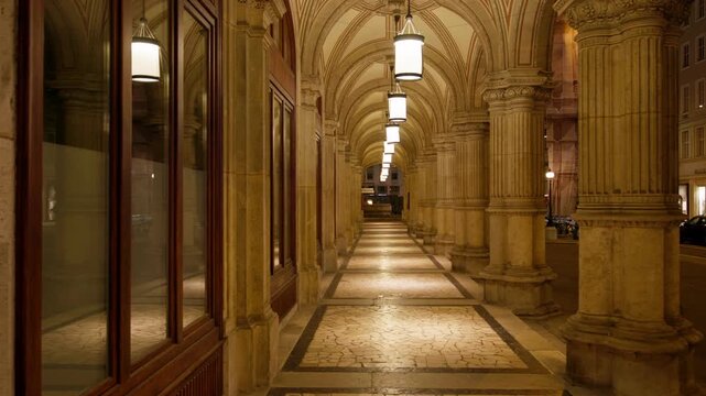 Beautiful night scene of Vienna city streets with glowing lights and ancient architecture in the old historical center of Austria popular for tourism