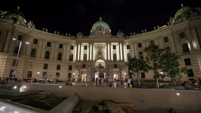 Hofburg Imperial Palace night Vienna Austria. Beautiful urban cityscape historical architecture of the streets of the capital in Europe.