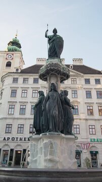 Astria Fountain in the center of the capital Vienna. Cityscape tourist points and historical cityscapes in Europe.