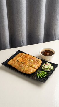 Indonesian Savory Perfection: Classic Martabak Telur with Spicy Dipping Sauce