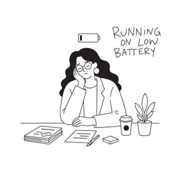 Exhausted office worker sitting at her desk with a nearly empty battery symbol, representing low energy and burnout.