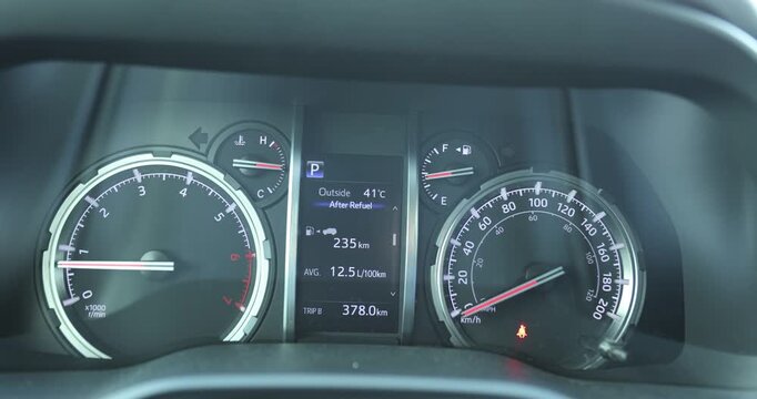 Car dashboard showing the outside temperature high to 41  degrees celsius in summer
