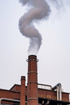 Industrial smokestack emitting thick smoke
