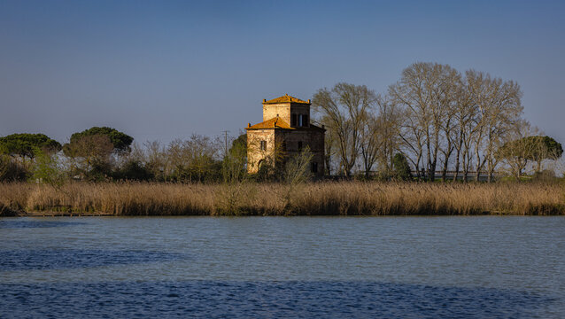 Historic building by river in Mesola, Emilia-Romagna, Italy