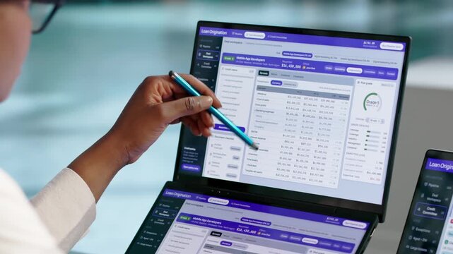 Loan Officer Reviews Credit Risk Data