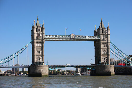 Iconic Tower Bridge over River Thames on sunny day in London England