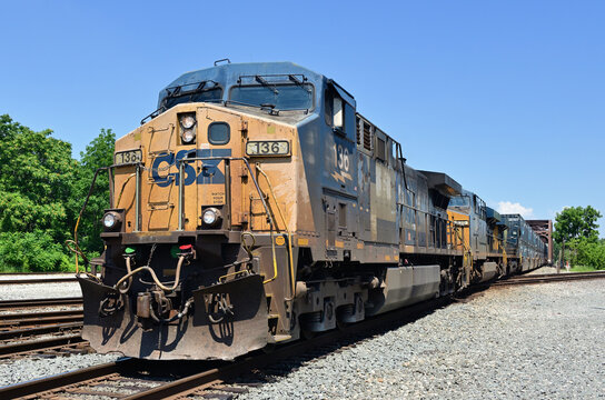 CSX Transportation locomotives lead a container train over a diamond crossing in the south suburbs of Chicago. 