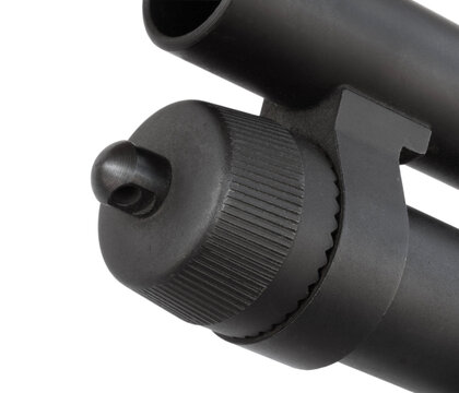 Close-up of the magazine cap on a 12-gauge shotgun