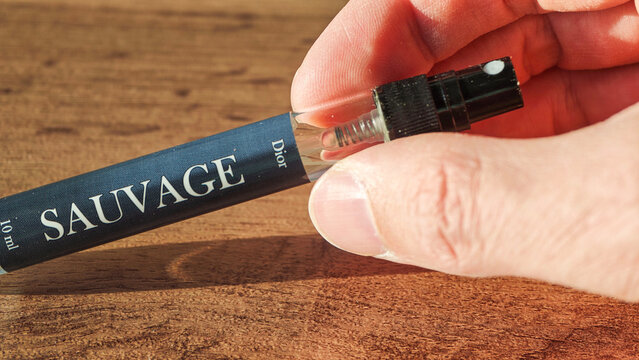 Sosnovy Bor, Russia &mdash; April, 21, 2026: Sauvage fragrance bottle held by a person