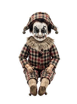 Creepy vintage harlequin doll with a sinister painted grin and checkered costume isolated on transparent background