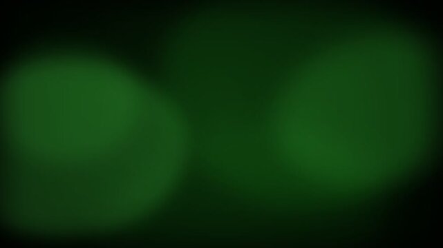 Abstract dark green background with soft out of focus light circles