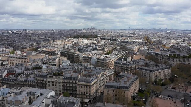 Aerial view of the dense urban architecture and historic rooftops of Paris, Ile-de-France, France.