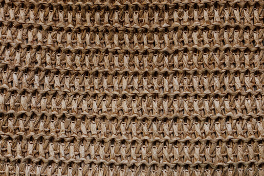 Natural raffia crochet woven textile texture close up