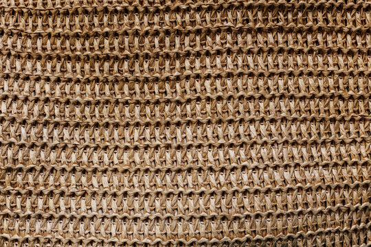 Natural raffia crochet woven texture background