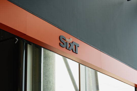 August 15, 2026, Stavanger, Norway - Sixt car rental logo on a building facade at Stavanger Airport