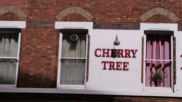 Leicester, England, UK - 3 September 2026: CHERRY TREE traditional British pub facade with red brick wall and sash windows