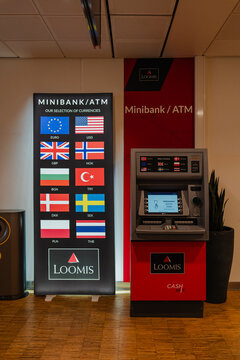 August 15, 2026, Stavanger, Norway - Loomis Minibank/ATM with currency selection sign at Stavanger Airport