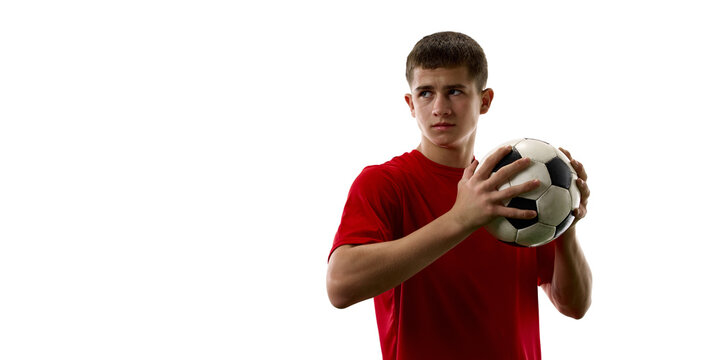 Young soccer player holding football before training session. Concept of athlete portrait, team selection, youth development and football participation.