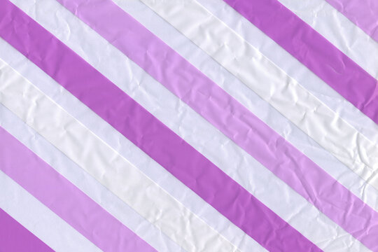 Purple and white diagonal stripes background. Pastel geometric pattern.