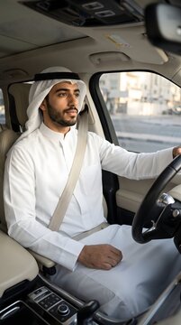 Gulf Arab Man Driving a Modern Car in the City