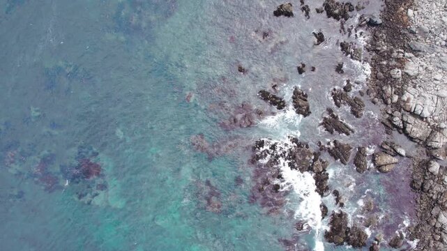 Overhead View Of Sea Waves Crashing Against Rocks Along Isla Negra Coast, Chile