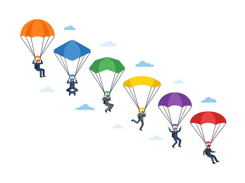 Diverse group skydiving with colorful parachutes